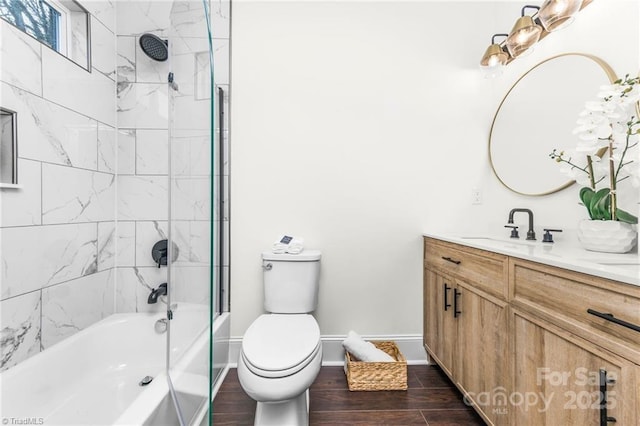 900 Gales Ave, Winston Salem, NC 27103 - bathroom with toilet, wood finished floors, baseboards, vanity, and shower / bathing tub combination