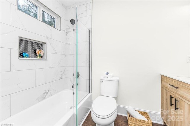 900 Gales Ave, Winston Salem, NC 27103 - full bath with toilet, wood finished floors, vanity,  shower combination, and baseboards