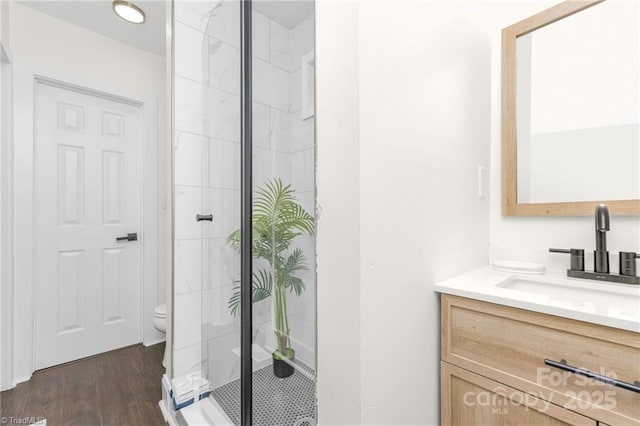 900 Gales Ave, Winston Salem, NC 27103 - bathroom featuring a stall shower, vanity, toilet, and wood finished floors