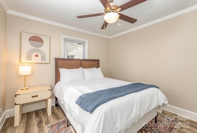 3141 Mathis Dr, Charlotte, NC 28208 - bedroom with crown molding, baseboards, a ceiling fan, and wood finished floors