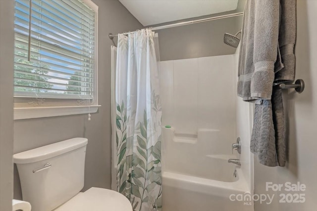 full bathroom featuring toilet and shower / bathtub combination with curtain