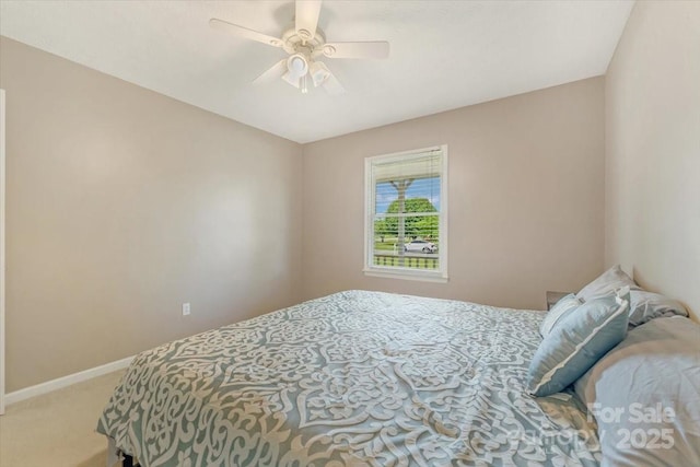bedroom with carpet, baseboards, and ceiling fan