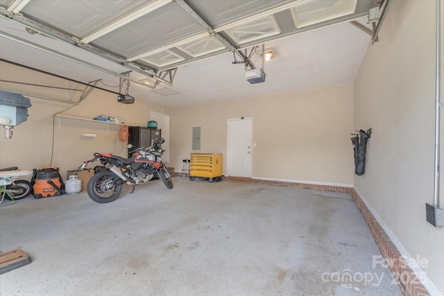garage with a garage door opener and electric panel