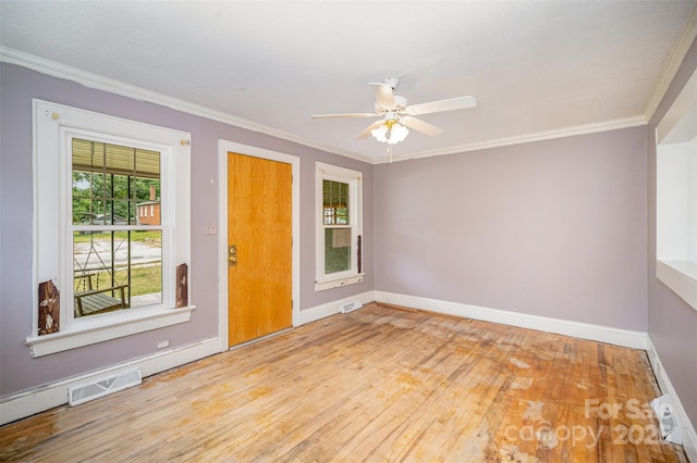813 S Ridge Ave, Kannapolis, NC 28083 - empty room featuring wood finished floors, baseboards, ornamental molding, and a ceiling fan