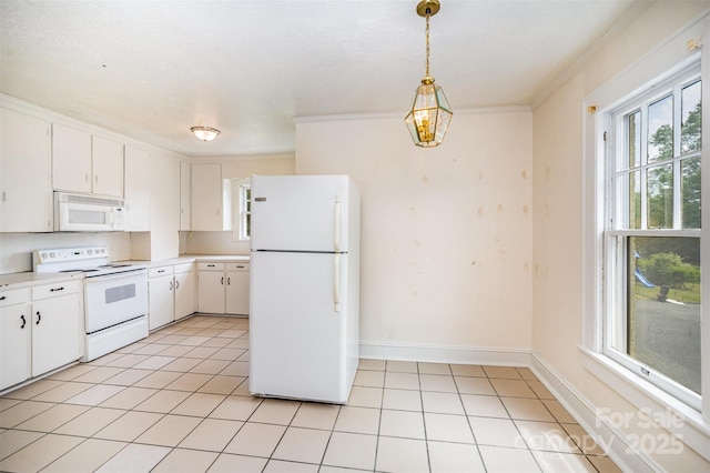 813 S Ridge Ave, Kannapolis, NC 28083 - kitchen featuring white appliances, light countertops, light tile patterned floors, white cabinets, and ornamental molding