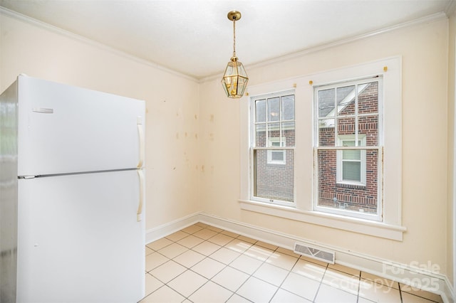 813 S Ridge Ave, Kannapolis, NC 28083 - unfurnished dining area featuring crown molding, light tile patterned floors, and baseboards