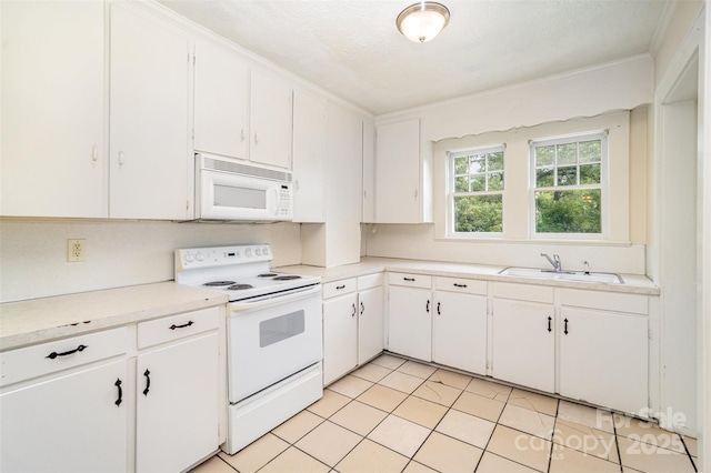813 S Ridge Ave, Kannapolis, NC 28083 - kitchen with white appliances, a sink, light countertops, white cabinetry, and light tile patterned flooring