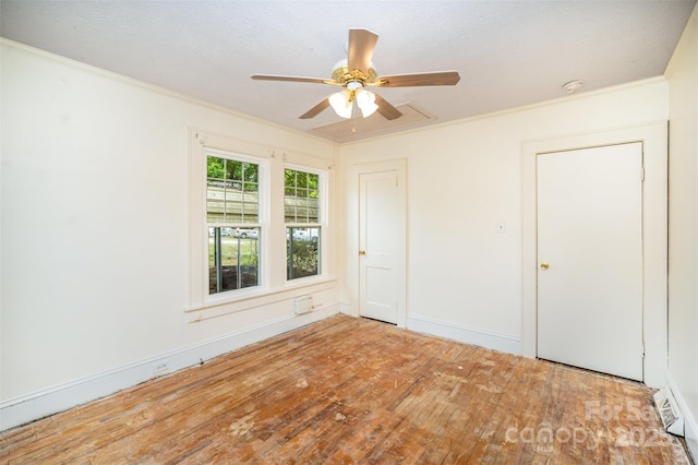 813 S Ridge Ave, Kannapolis, NC 28083 - spare room featuring ornamental molding, ceiling fan, hardwood / wood-style floors, and baseboards