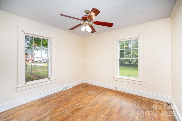 813 S Ridge Ave, Kannapolis, NC 28083 - spare room featuring crown molding, plenty of natural light, hardwood / wood-style flooring, baseboards, and a ceiling fan