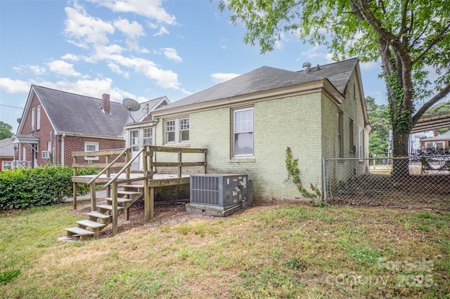 813 S Ridge Ave, Kannapolis, NC 28083 - back of property with cooling unit, brick siding, and a wooden deck