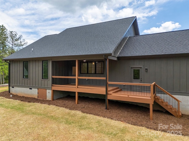 109 Ashley Ct, Mill Spring, NC 28756 - back of house featuring crawl space, a deck, roof with shingles, board and batten siding, and a lawn