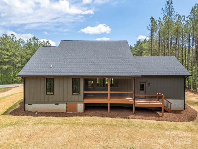 109 Ashley Ct, Mill Spring, NC 28756 - back of property featuring crawl space, roof with shingles, a yard, and a wooden deck