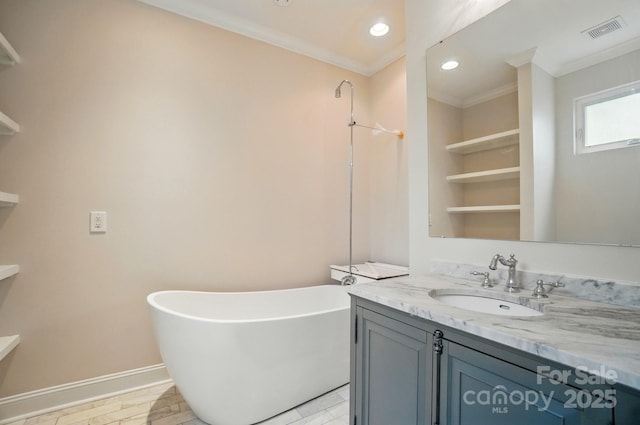 945 Westbrook Dr Unit A, Charlotte, NC 28202 - full bathroom featuring a freestanding bath, vanity, crown molding, and recessed lighting