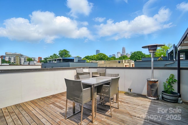 945 Westbrook Dr Unit A, Charlotte, NC 28202 - wooden deck with a view of city and outdoor dining area