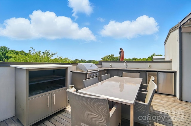 945 Westbrook Dr Unit A, Charlotte, NC 28202 - wooden terrace with exterior kitchen and outdoor dining area