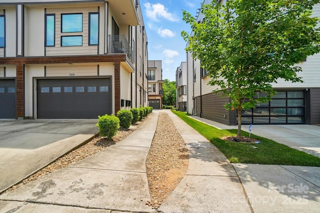 945 Westbrook Dr Unit A, Charlotte, NC 28202 - view of property exterior featuring a garage and driveway