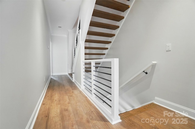 945 Westbrook Dr Unit A, Charlotte, NC 28202 - hallway featuring an upstairs landing, wood finished floors, and ornamental molding