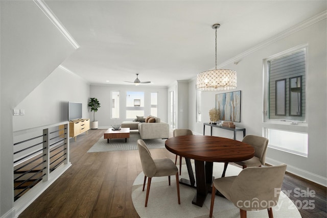 945 Westbrook Dr Unit A, Charlotte, NC 28202 - dining area featuring dark wood-style floors, crown molding, a chandelier, and a ceiling fan