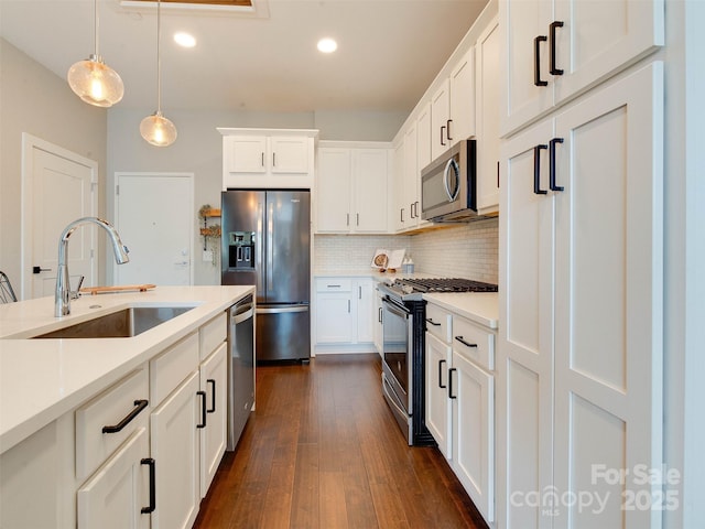 2401 Euclid Ave Unit 207, Charlotte, NC 28203 - kitchen featuring stainless steel appliances, a sink, backsplash, light countertops, and recessed lighting
