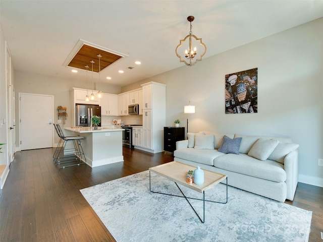 2401 Euclid Ave Unit 207, Charlotte, NC 28203 - living room with dark wood-type flooring, recessed lighting, a chandelier, and baseboards