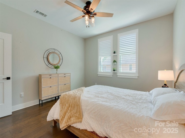 2401 Euclid Ave Unit 207, Charlotte, NC 28203 - bedroom with dark wood finished floors, baseboards, and ceiling fan