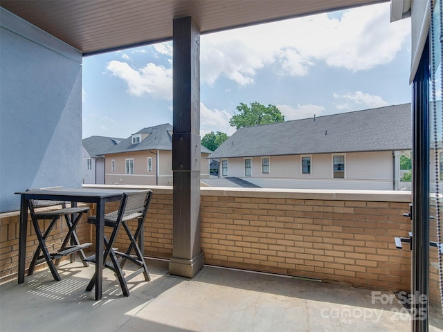 2401 Euclid Ave Unit 207, Charlotte, NC 28203 - view of patio featuring a residential view and a balcony