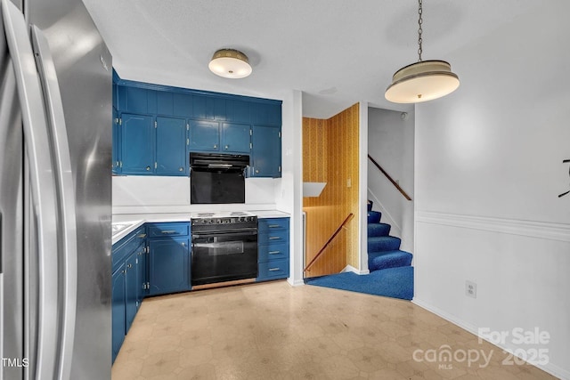 kitchen with freestanding refrigerator, electric range, light floors, light countertops, and blue cabinetry