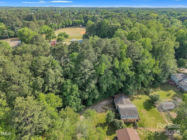 drone / aerial view featuring a forest view
