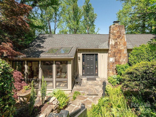 203 Lake Dr, Hendersonville, NC 28739 - exterior space featuring a shingled roof and a chimney