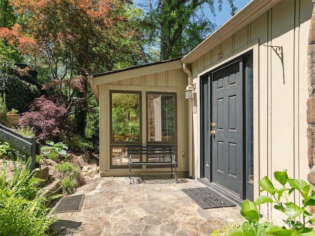 203 Lake Dr, Hendersonville, NC 28739 - view of exterior entry with board and batten siding and visible vents