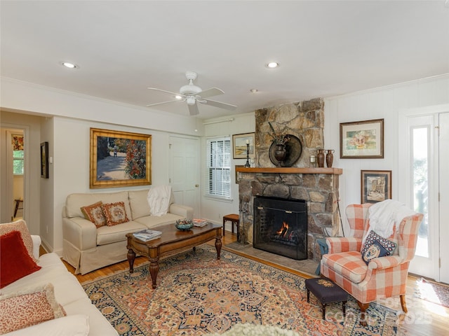 203 Lake Dr, Hendersonville, NC 28739 - living area featuring a wealth of natural light, wood finished floors, a ceiling fan, and a stone fireplace