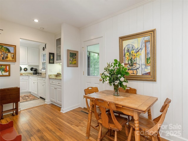 203 Lake Dr, Hendersonville, NC 28739 - dining space with crown molding and light wood-style floors