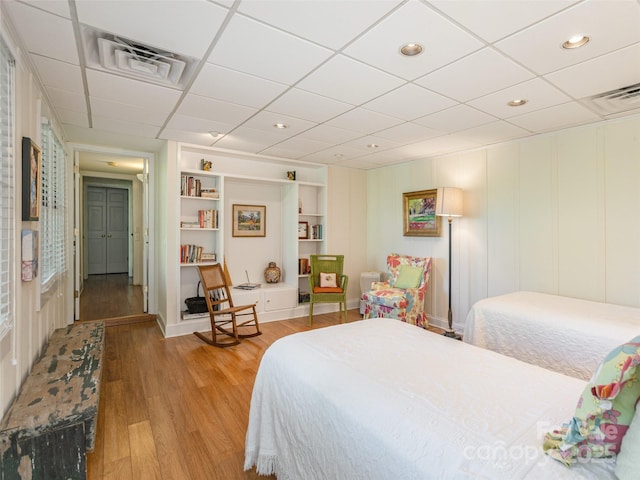 203 Lake Dr, Hendersonville, NC 28739 - bedroom featuring light wood finished floors, a decorative wall, visible vents, and recessed lighting