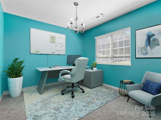 office area with carpet flooring, a chandelier, and baseboards