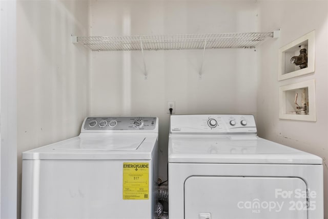 laundry area with washing machine and dryer
