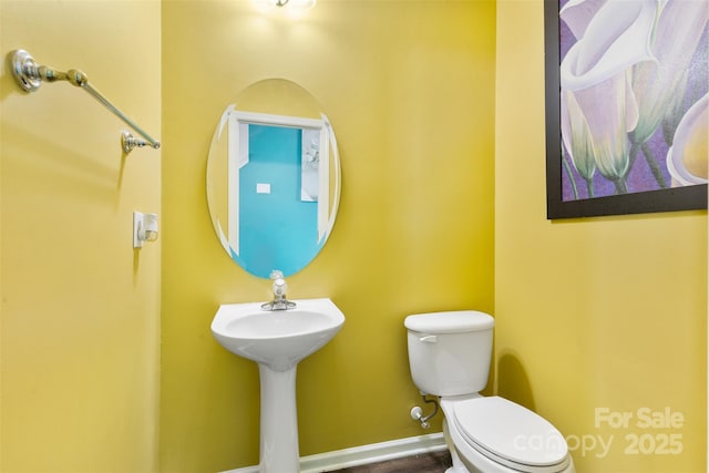 half bathroom with toilet