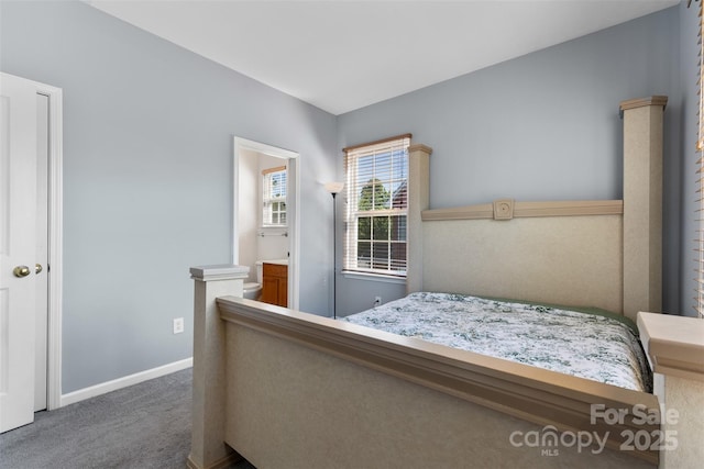 carpeted bedroom featuring baseboards