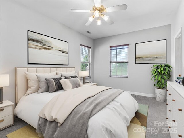 bedroom featuring light carpet, baseboards, and ceiling fan