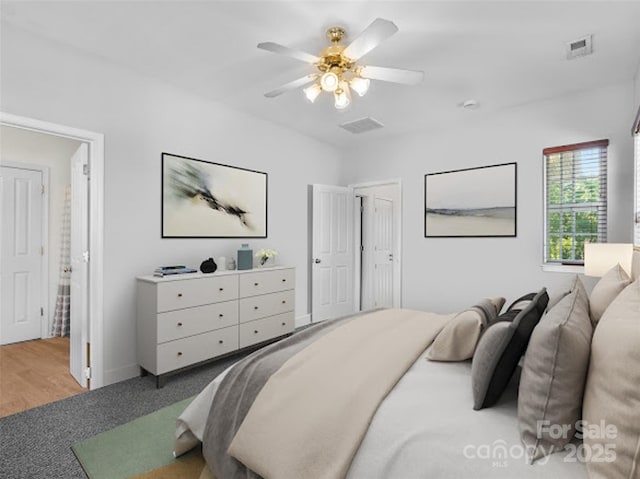 carpeted bedroom featuring a ceiling fan and baseboards