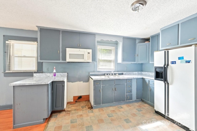 409 Rosemont Ave, Kannapolis, NC 28081 - kitchen with a sink, white appliances, gray cabinets, a textured ceiling, and light countertops