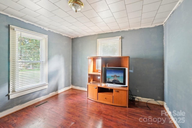 409 Rosemont Ave, Kannapolis, NC 28081 - unfurnished living room featuring baseboards, visible vents, and wood finished floors
