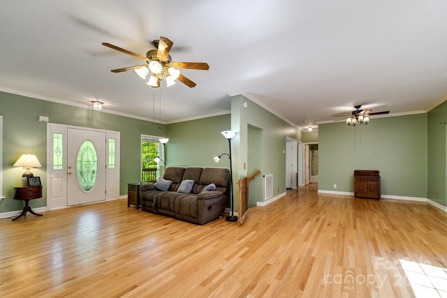910 Hannah Mountain Rd, Otto, NC 28763 - living room featuring ceiling fan, crown molding, light wood finished floors, and visible vents