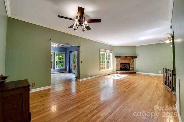 910 Hannah Mountain Rd, Otto, NC 28763 - unfurnished living room featuring light wood-style floors, crown molding, and ceiling fan