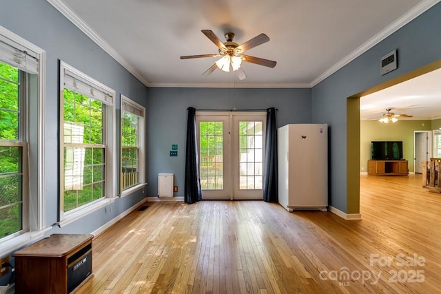 910 Hannah Mountain Rd, Otto, NC 28763 - entryway with heating unit, crown molding, baseboards, ceiling fan, and hardwood / wood-style flooring