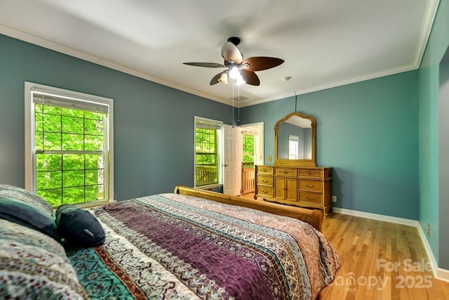 910 Hannah Mountain Rd, Otto, NC 28763 - bedroom featuring a ceiling fan, baseboards, visible vents, crown molding, and wood finished floors