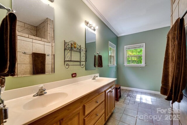 910 Hannah Mountain Rd, Otto, NC 28763 - full bath featuring tile patterned floors, crown molding, a sink, and double vanity
