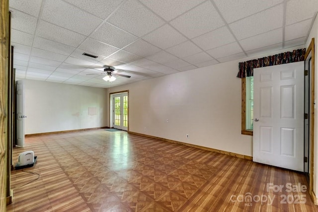 910 Hannah Mountain Rd, Otto, NC 28763 - spare room featuring baseboards, a paneled ceiling, ceiling fan, and visible vents