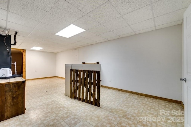 910 Hannah Mountain Rd, Otto, NC 28763 - interior space featuring a drop ceiling, baseboards, and tile patterned floors