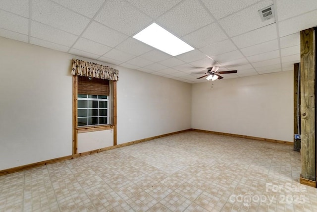 910 Hannah Mountain Rd, Otto, NC 28763 - unfurnished room featuring a drop ceiling, baseboards, visible vents, and ceiling fan