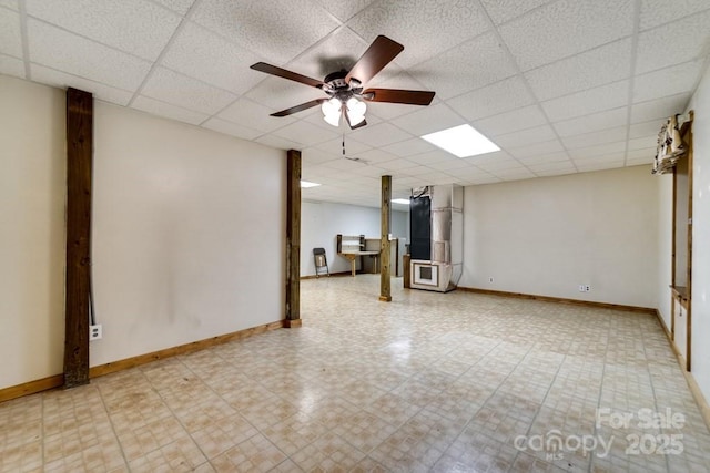 910 Hannah Mountain Rd, Otto, NC 28763 - interior space featuring a paneled ceiling, heating unit, baseboards, and a ceiling fan